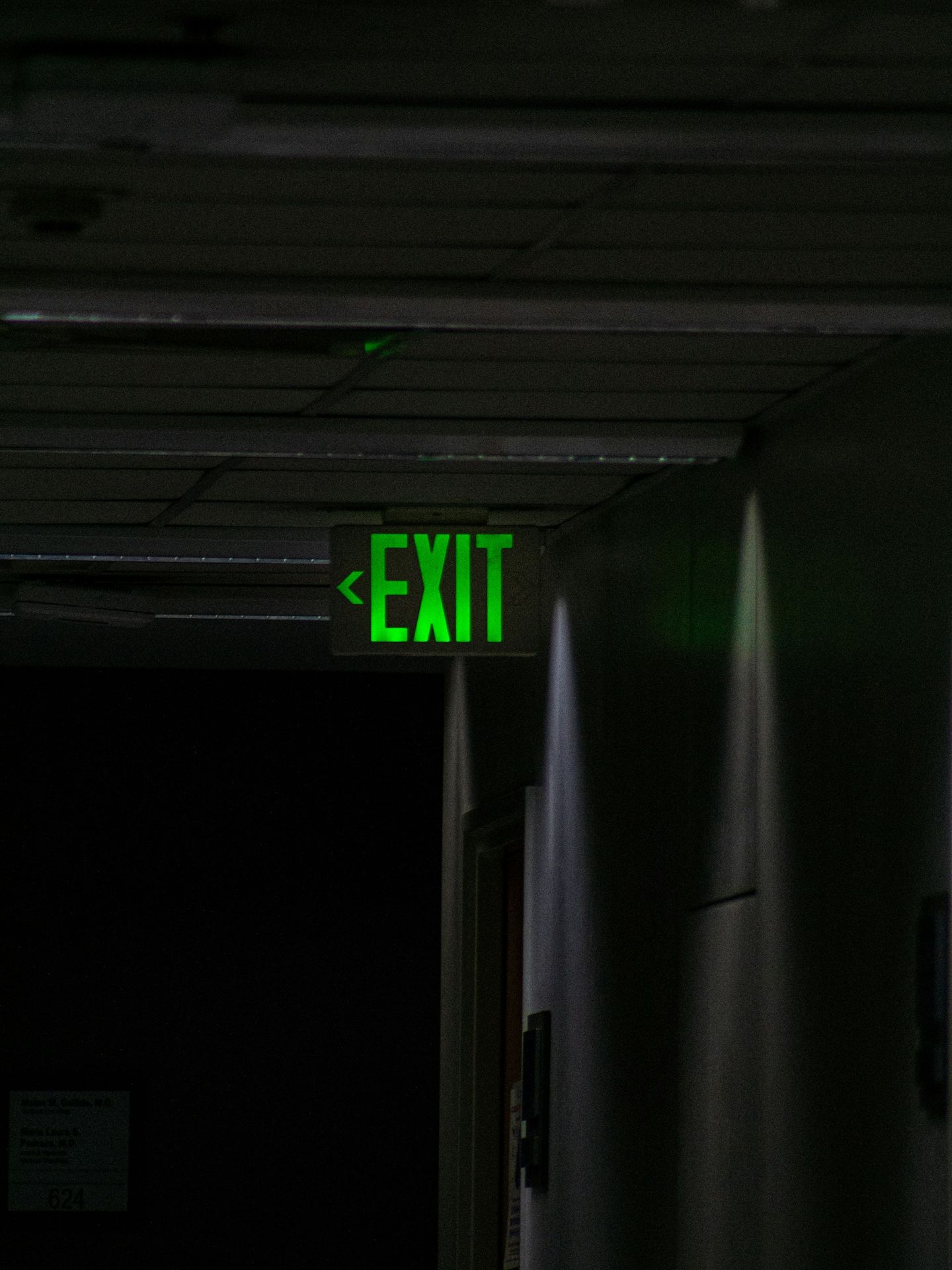 green and white exit sign